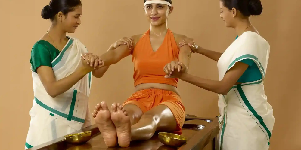 Practitioner performing oil massage on a client's back.